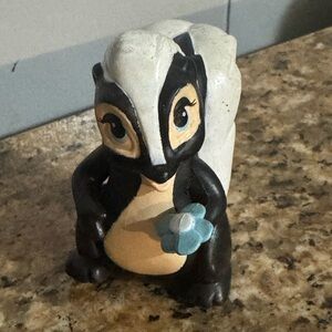 Vintage Disney Skunk Figurine with Blue Flower